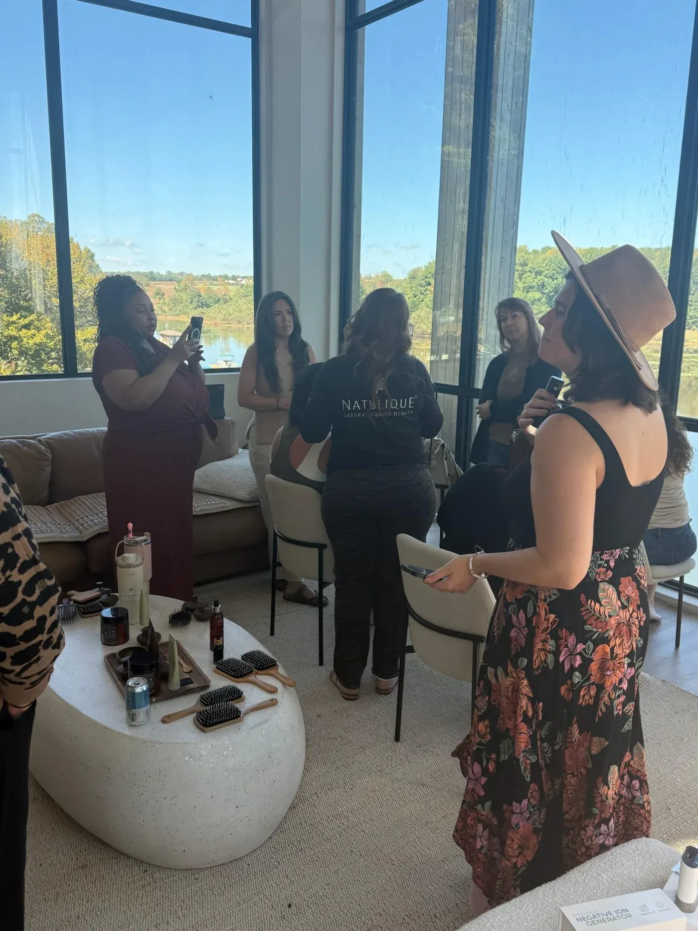 Account Managers trying products and styling tools during a hands-on retreat demonstration overlooking the lake