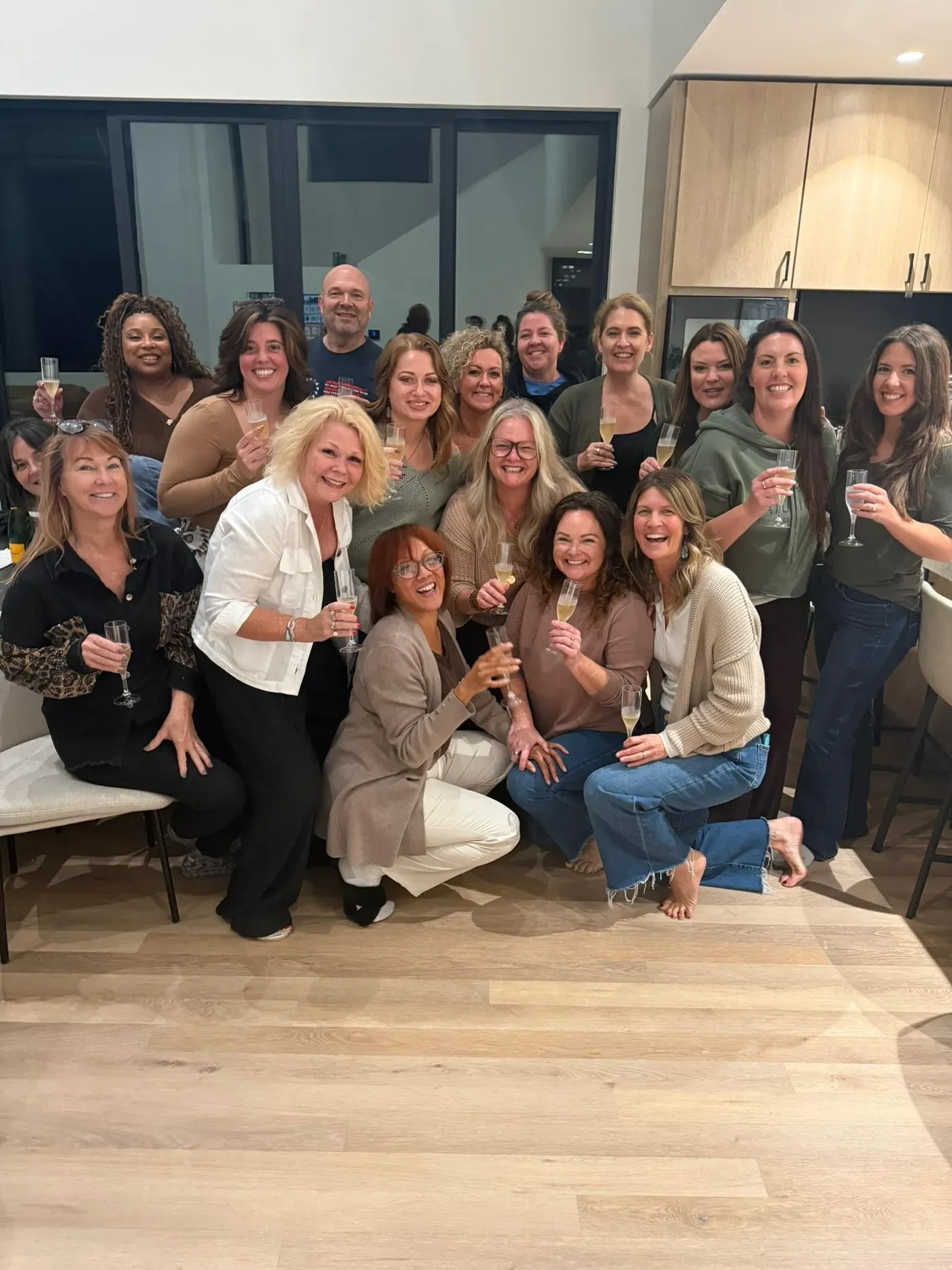 The Root & Bloom team raising a glass together on the final evening of the retreat